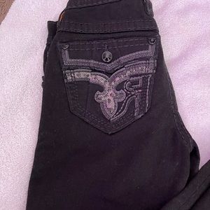 Black skinny mid rise rock revivals